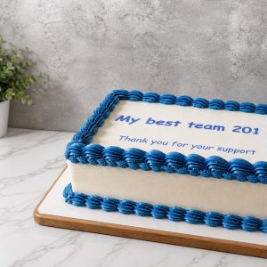 A rectangular cake with blue icing borders and the message My best team 201 Thank you for your support on a marble worktop.